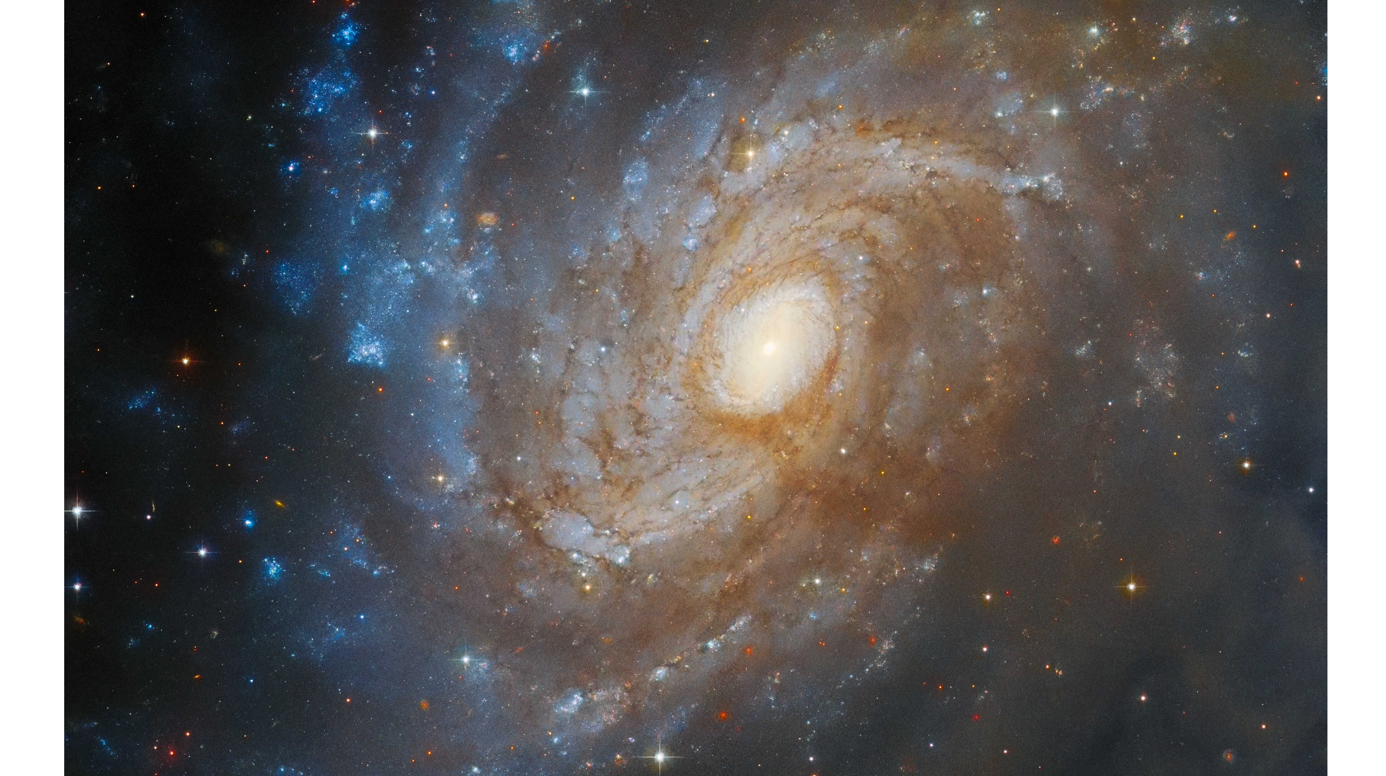 The Hubble telescope saw a spiral galaxy in a dark cloud