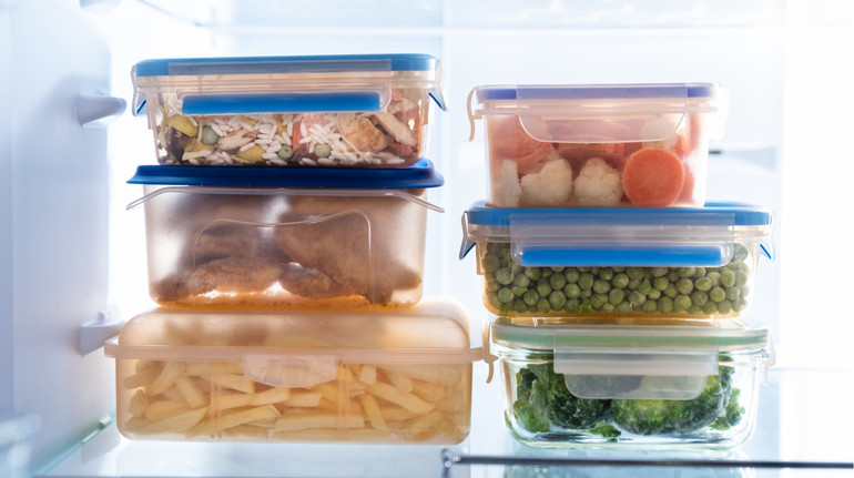 Is it possible to heat food in plastic containers in a microwave