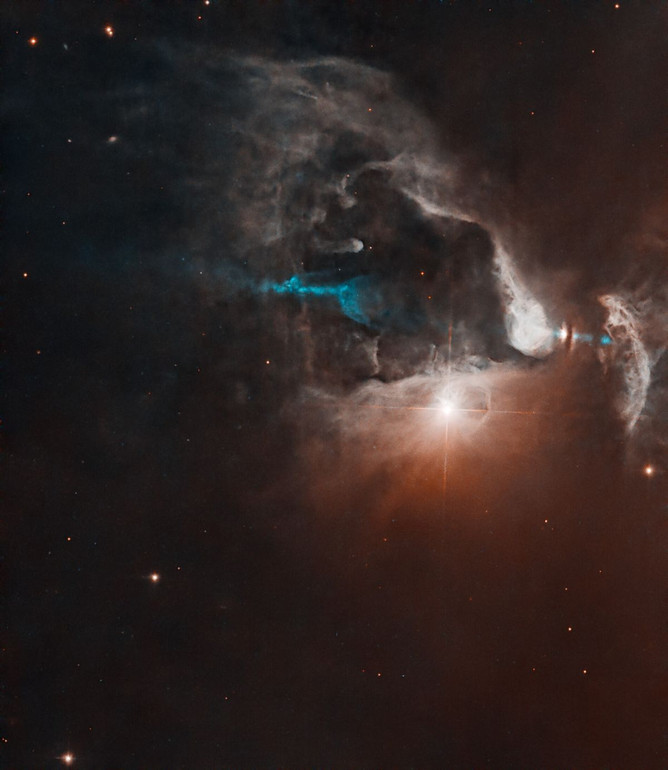 Hubble telescope image of the FS Tau system with the bright light at its center, the young star FS Tau B