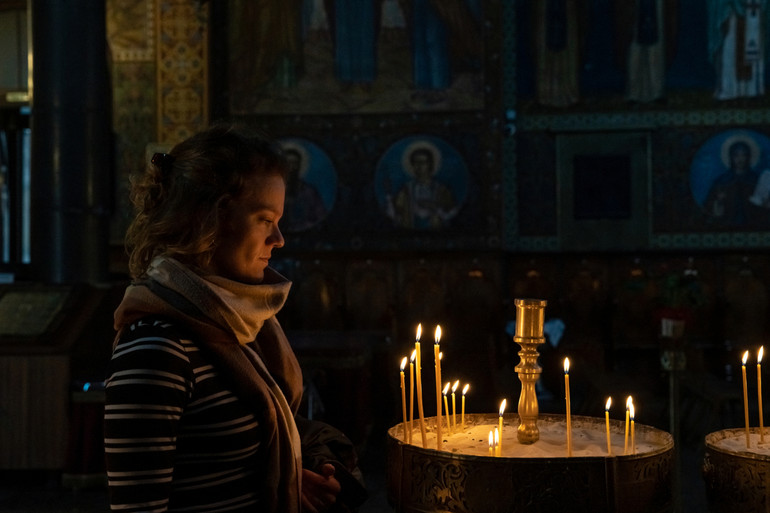 prayer in the temple near the candles