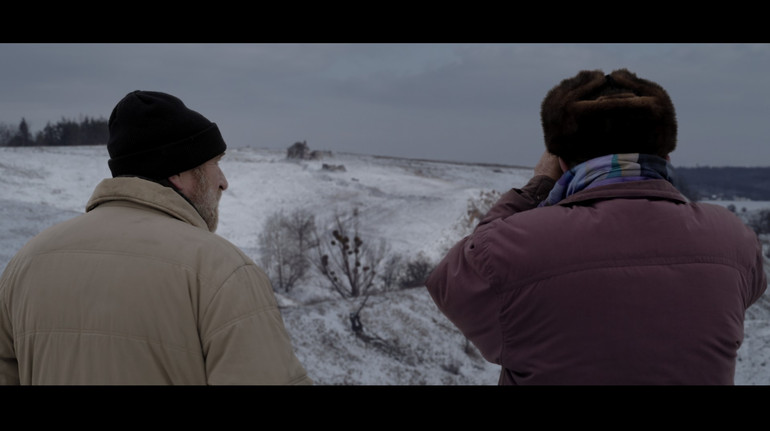 A frame from the movie Gray Bees
