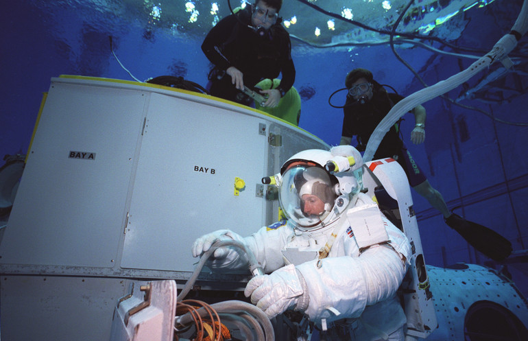 An astronaut in a water tank.