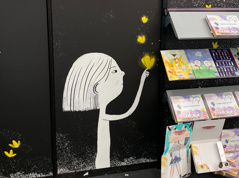 The main character of the book Yellow Butterfly is depicted on the stand