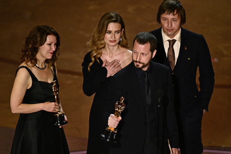 Film crew on stage at the Oscars