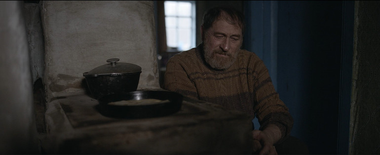 A frame from the movie Gray Bees