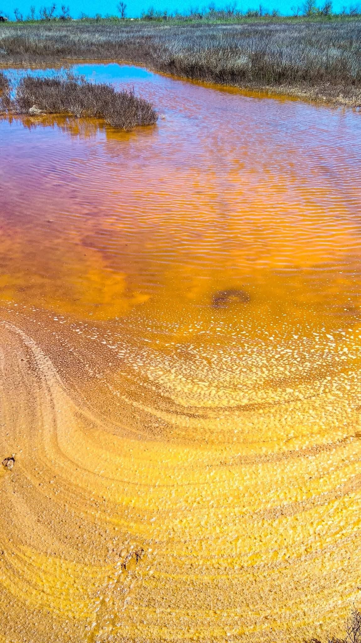 A reservoir with amber water